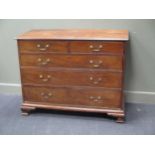 A George III mahogany chest of two short over three long graduating drawers on ogee bracket feet