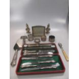 A cased silver writing set, a silver perpetual calendar and various other small silver items
