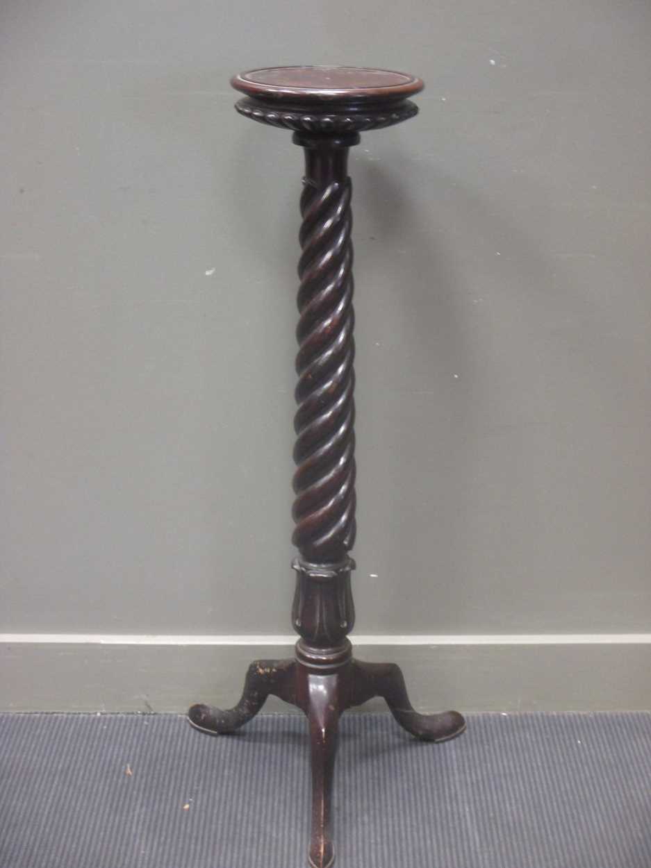 A Victorian mahogany bed-post torchere,