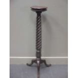 A Victorian mahogany bed-post torchere,