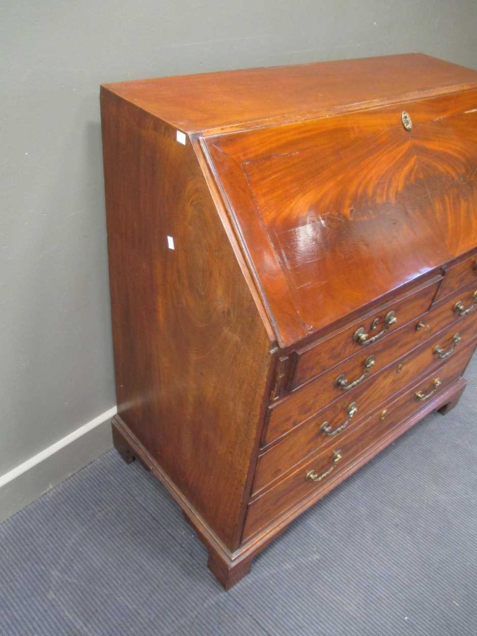 A George III mahogany bureau, circa 1770, with well fitted interior, pigeonholes and drawers above - Image 4 of 7