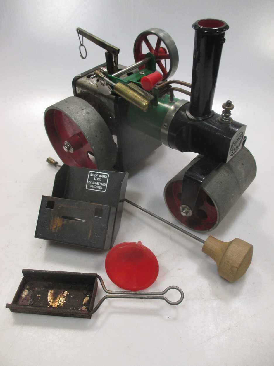 A boxed Mamod live steam model roller, together with two shooting sticks