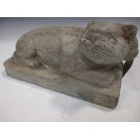 A Chinese carved limestone recumbent fo-dog, in Ming style, with well detailed face and mane, 30 x