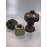 A Chinese carved black stone censer and cover in archaic style, scroll pierced cover, and incised