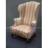A William and Mary reproduction wing back armchair (a/f, worn)