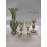 A Victorian overlaid glass vase and opaque glass vase with 'jewelled' beaded body, together with a