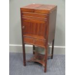 A George III mahogany dressing cupboard 86 x 35 x 35cm and a torchere 124cm high (2)