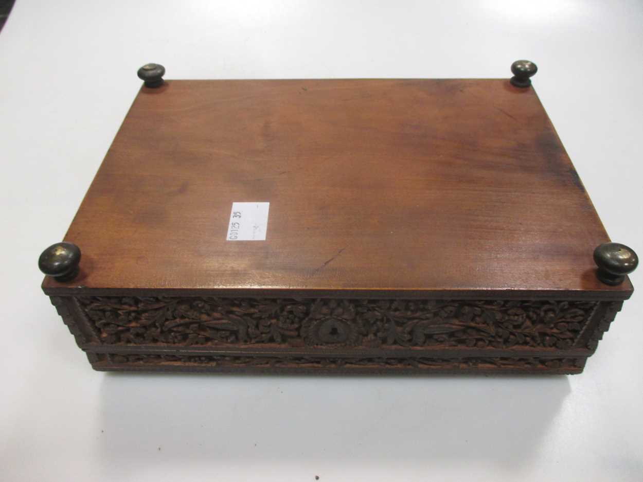 An Indian/Asian carved wood box, probably c.1900, with three figures to the lid, on brass feet, 23 x - Image 3 of 6