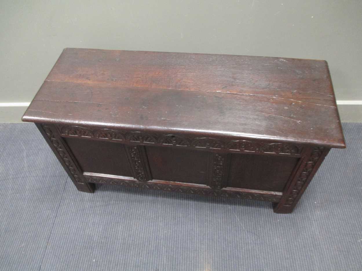 An 18th century three panel coffer with carved front decoration and internal candle box with lid - Image 8 of 8