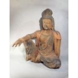 A Chinese carved and polychrome painted wood seated figure of Guanyin, in Song Dynasty style,