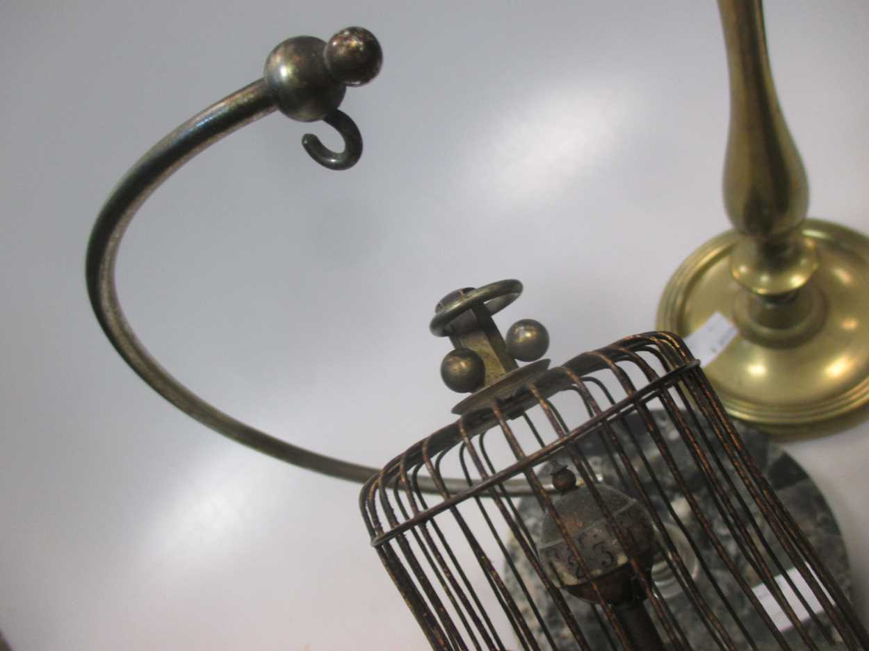A pair of late 19th century brass candlesticks, a model bird in a suspended cage musical box and a - Image 4 of 6