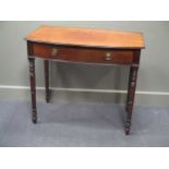 A late George III mahogany bow front side table the single frieze drawer over ring turned tapering