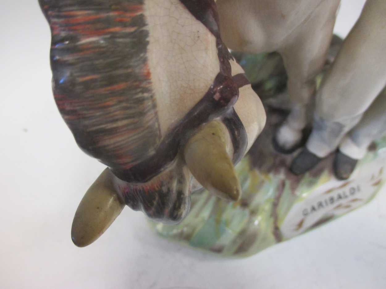 A large Staffordshire pottery group of Garibaldi standing aside his horse, 37cm high (restored) - Image 5 of 8