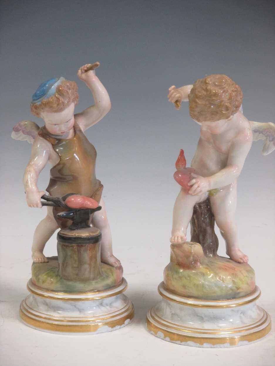 A pair of Meissen figures of cherubs, crossed swords mark, one incised L109, the other L14 (2)