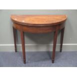 A George III mahogany demi-lune card table, with chevron banded top, on square tapering legs with