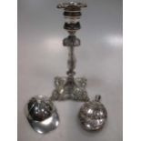 A Tiffany jockey cap silver caddy spoon, a plated taper stick, and a decorative silver locket (3)
