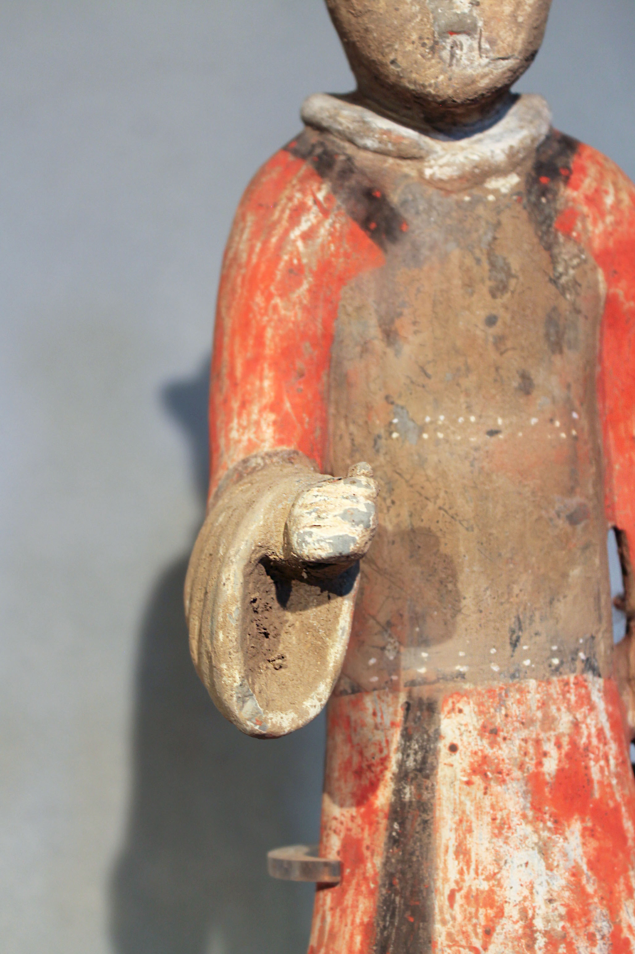 A Chinese painted pottery standing figure of a guard or attendant, perhaps Han Dynasty, 44.5cm - Image 2 of 5