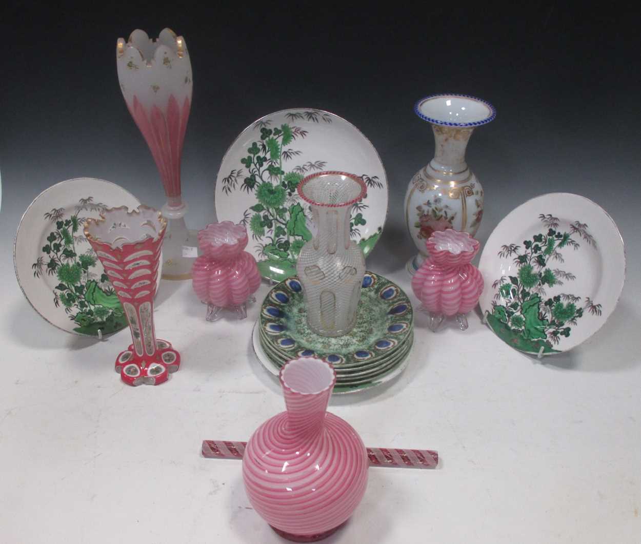 A small collection of glass vases with painted and cut decoration, others and various decorated