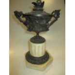 A 19th century 'grand tour' style bronze classical urn with cover on marble stand, 30cm high