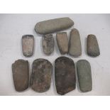 A collection of Neolithic axe heads in a box