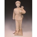 A Chinese white unglazed porcelain figure of a Maoist soldier, mid/late 20th century, impressed