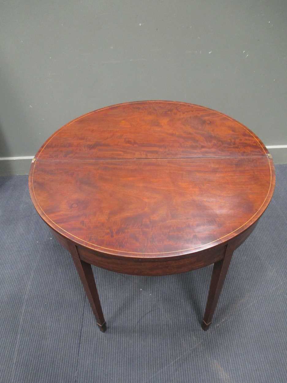 A George III mahogany demi-lune card table, with chevron banded top, on square tapering legs with - Bild 5 aus 5