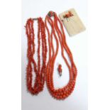 Two strings of three row coral beads along with a brooch and multiple pins (4)