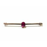 Bar brooch with a synthetic ruby, tested as 9ct gold, weight 2.4g