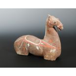 A Chinese painted grey pottery, horse torso, Han style, 23.5cm high