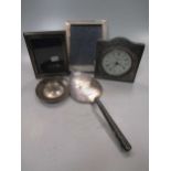 A silver 'Armada' style dish, a silver photograph frame and a silver mounted desk clock, together
