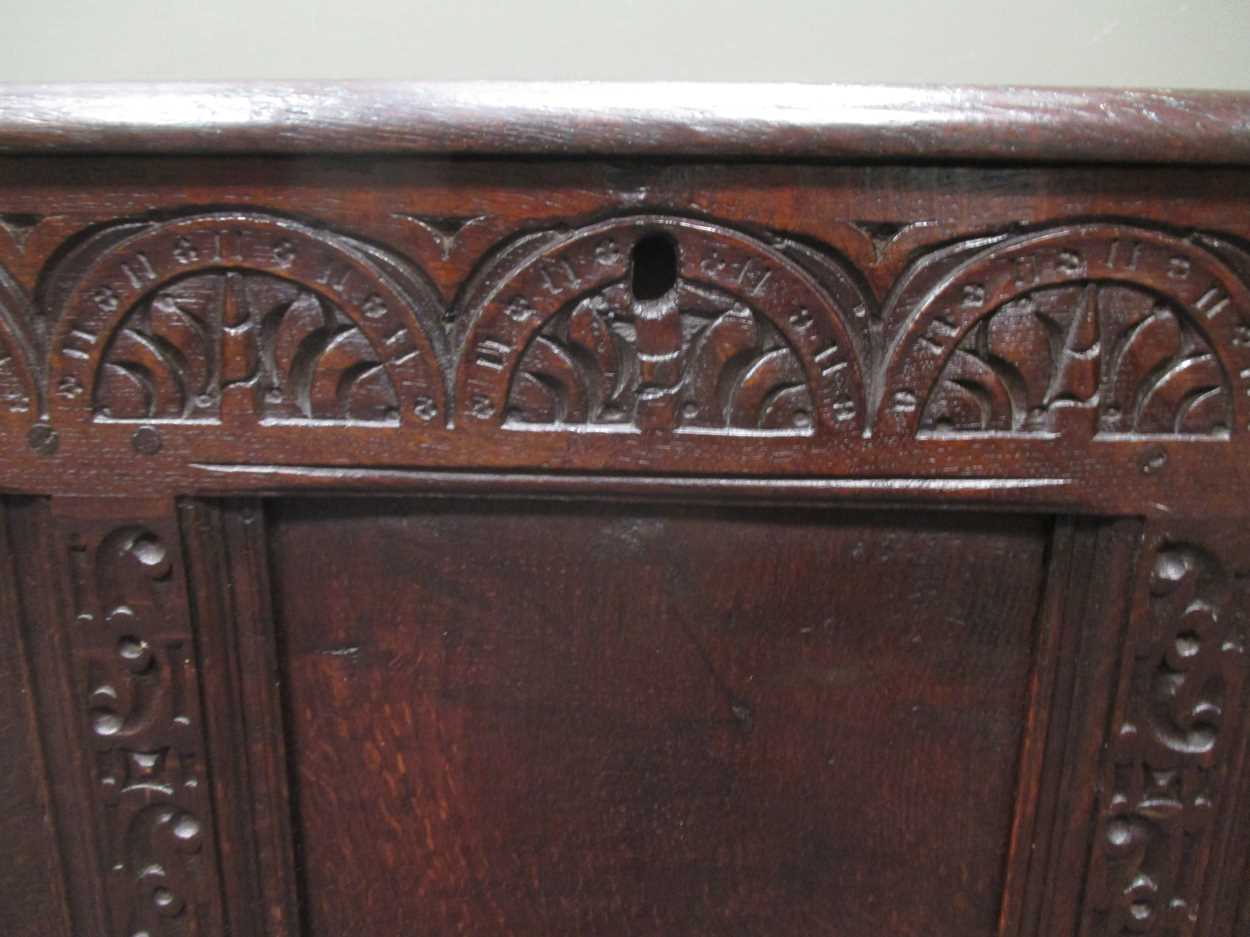 An 18th century three panel coffer with carved front decoration and internal candle box with lid - Image 7 of 8
