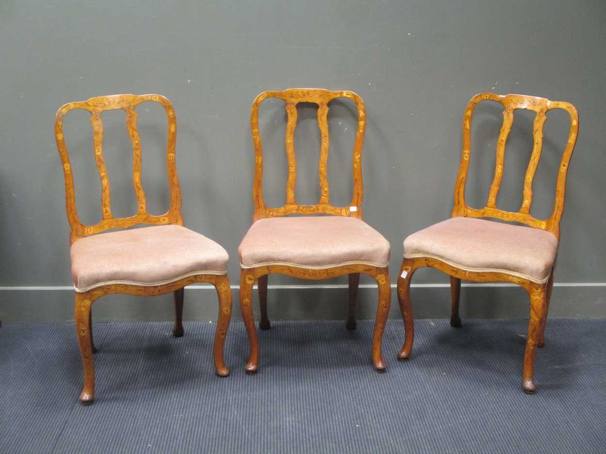 Three Dutch late 18th century or early 19th century floral marquetry side chairs, on cabriole