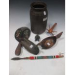 A group of tribal/ethnic decorative objects, including a face-back hand mirror, wooden pot, bird