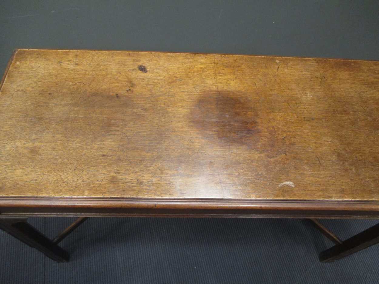 A George III style mahogany slender rectangular table, on moulded legs with shaped stretcher 77 x - Image 6 of 10