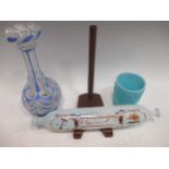 A Nailsea glass rolling pin, 32cm long; a blue pressed glass beaker, 9.5cm high, a Vaseline glass