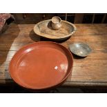 An Indian wood food bowl, 46cm diameter: A Burmese red lacquer circular bowl, 49cm diameter: four