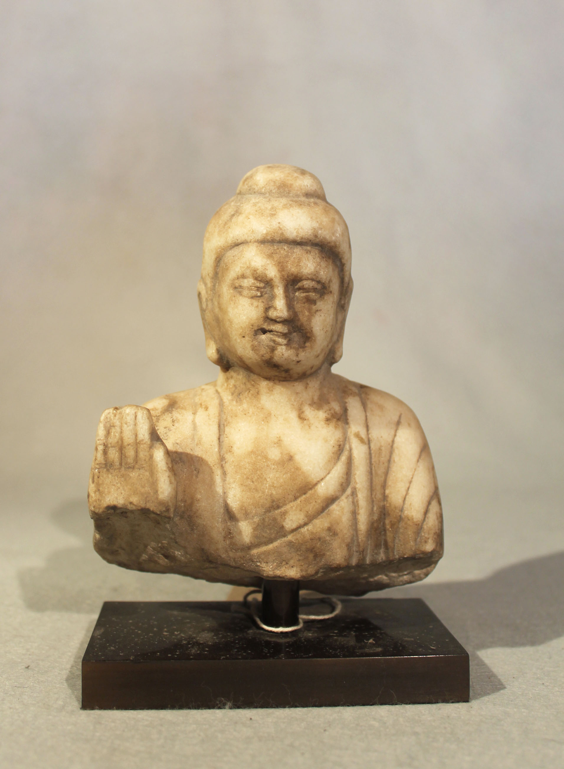 A Chinese white marble Buddha head and shoulders, in Northern Qi style,16cm high