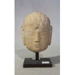 A Chinese pale cream stone head of Buddha, 11cm high