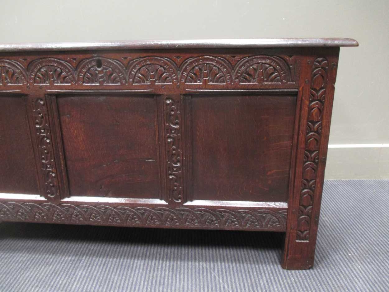 An 18th century three panel coffer with carved front decoration and internal candle box with lid - Image 6 of 8