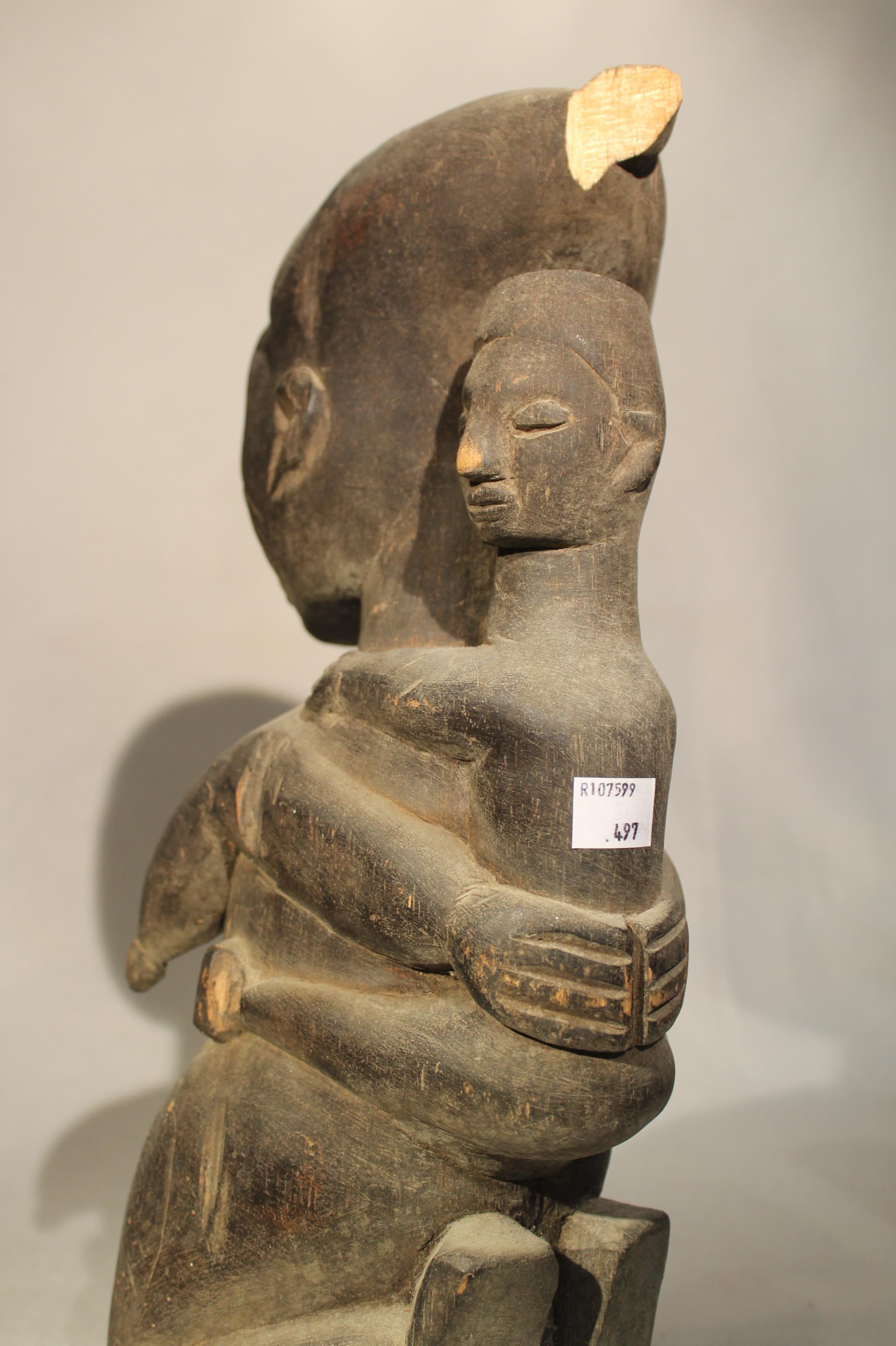 A Baluba wood headrest, with stylized kneeling figure with stepped fan coiffure, 21cm high; an Ibo - Image 5 of 5