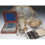 A silver plated two handled tray, a plated fruit bowl, a plate mounted caret jug, a set if plated