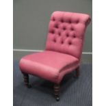 A small button back chair on turned legs 70 x 45 x 60cm