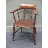 Circa 1830 an elm broad arm captains chair