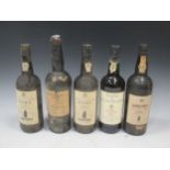 Sandeman 1966 vintage port (level very top shoulder), Grahams 1949 Crusted port (level around top of