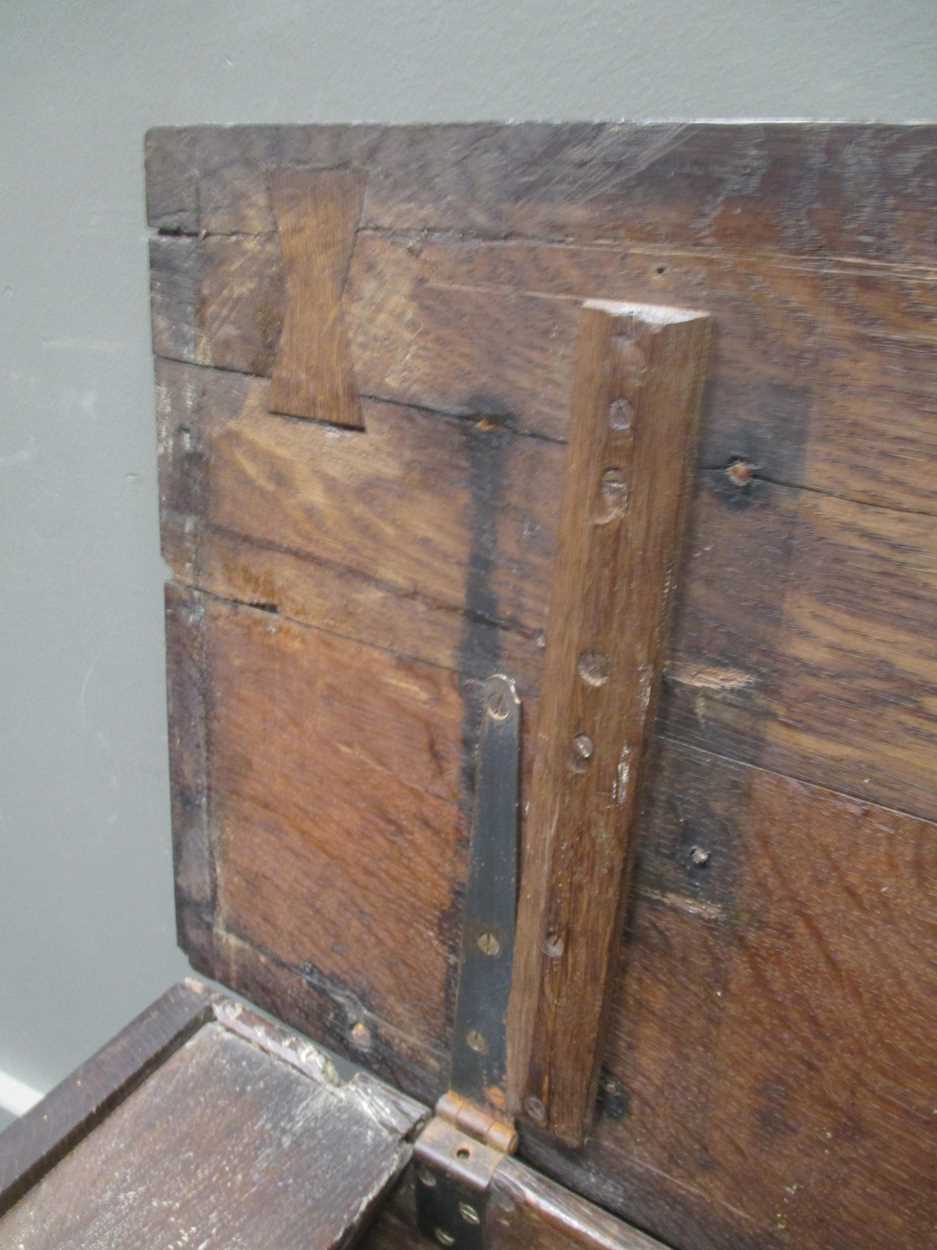 An 18th century three panel coffer with carved front decoration and internal candle box with lid - Image 5 of 8