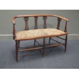 An Art Nouveau period two seat settee with bowed backrail 106cm wide