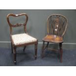 A Victorian rosewood balloon back dining chair and a Victorian Windsor wheelback single chair (2)