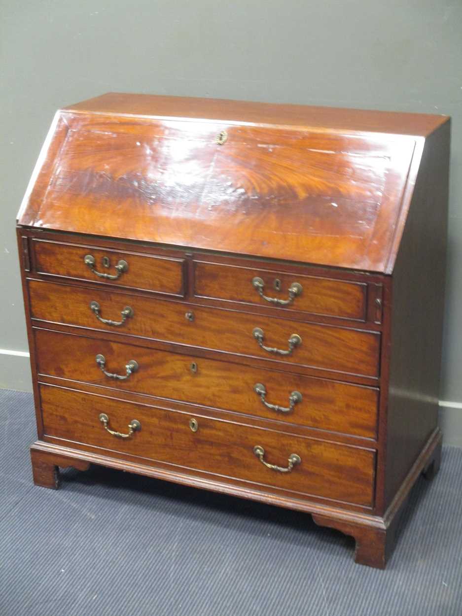 A George III mahogany bureau, circa 1770, with well fitted interior, pigeonholes and drawers above