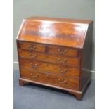 A George III mahogany bureau, circa 1770, with well fitted interior, pigeonholes and drawers above