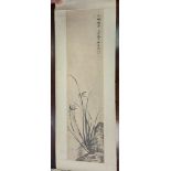 A Chinese Scroll Painting, Late Qing Dynasty/early 20th century, painted with flowering orchids